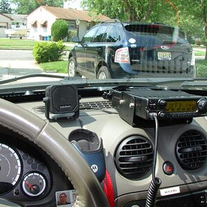 The IC-2200H on the dash with the Rat Shack mini extension speaker next to it. View from the driver's seat....